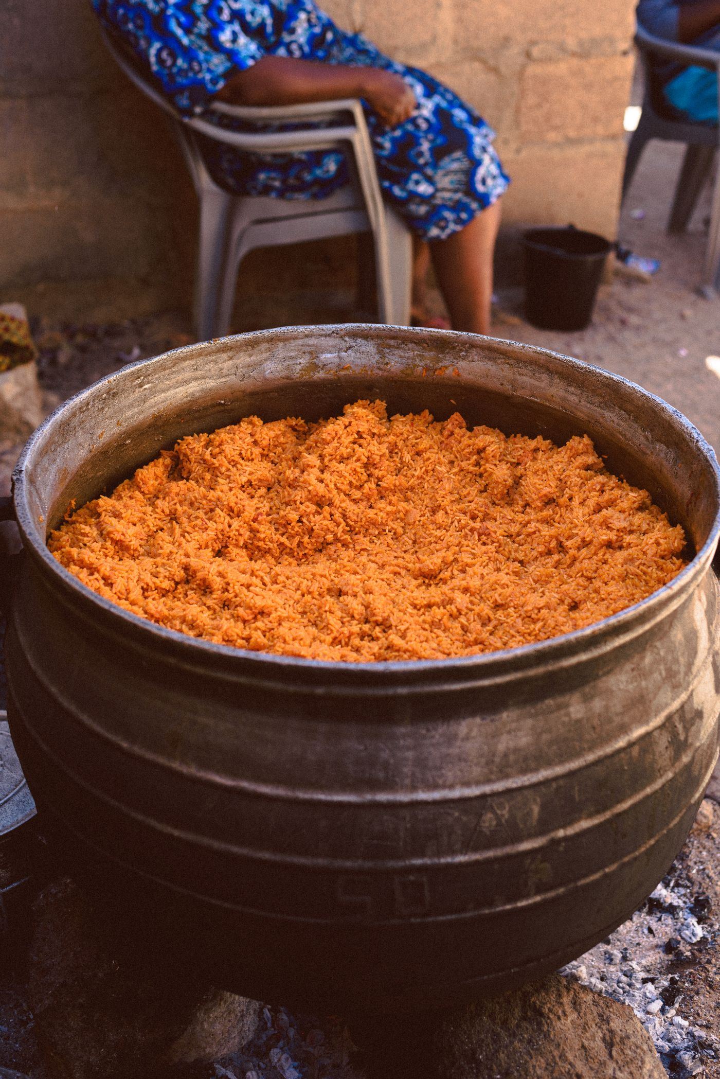 Party jollof cooking over wood fire